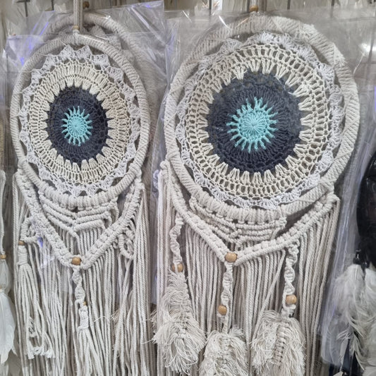 Crochet and macrame cotton dreamcatcher with evil eye motif and hanging tassels, 22cm diameter, handmade spiritual decor

