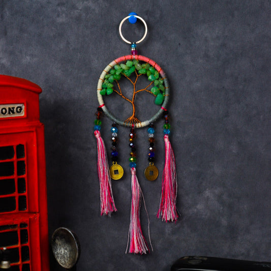 Turquoise-wrapped Tree of Life dreamcatcher keychain with green stone leaves and teal tassels.
