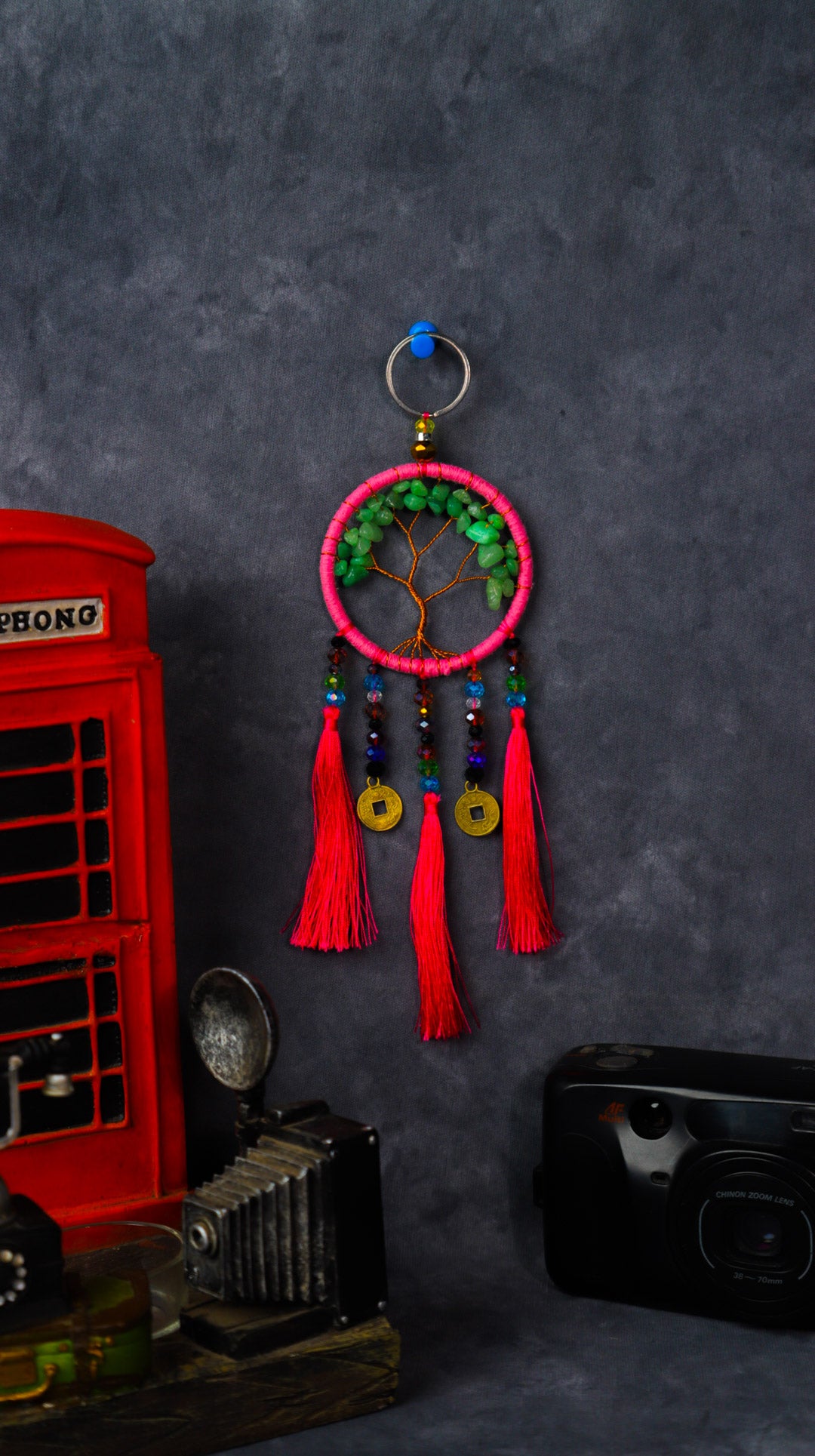 Turquoise-wrapped Tree of Life dreamcatcher keychain with green stone leaves and teal tassels.