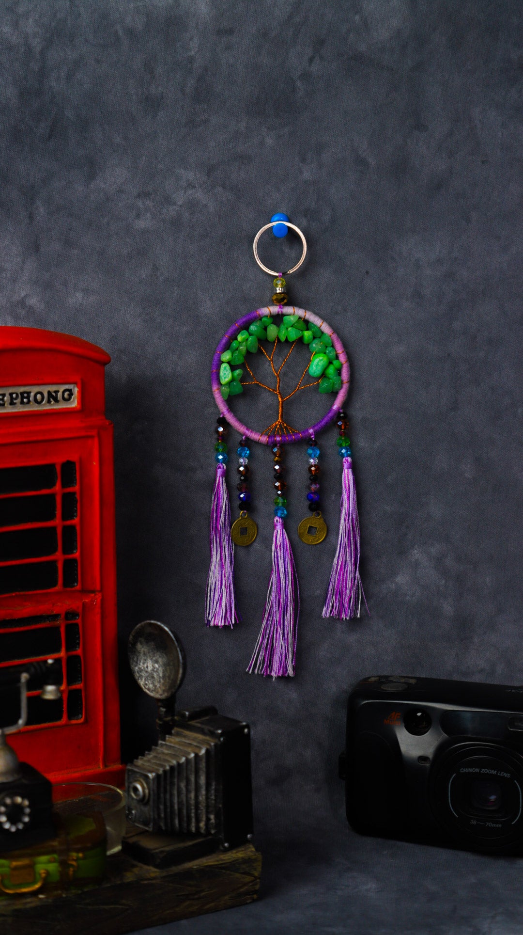Turquoise-wrapped Tree of Life dreamcatcher keychain with green stone leaves and teal tassels.
