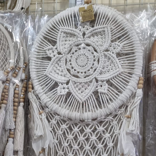 Bohemian macrame dreamcatcher with lotus flower mandala, featuring natural cotton rope, wood beads, and white feathers.
