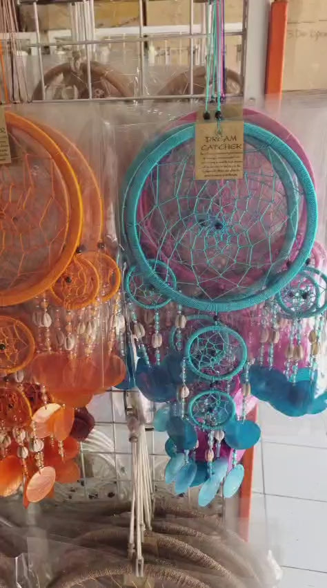 Colorful handmade dreamcatcher 16cm with nylon web, capiz shell discs, cowrie shells, boho wall hanging.