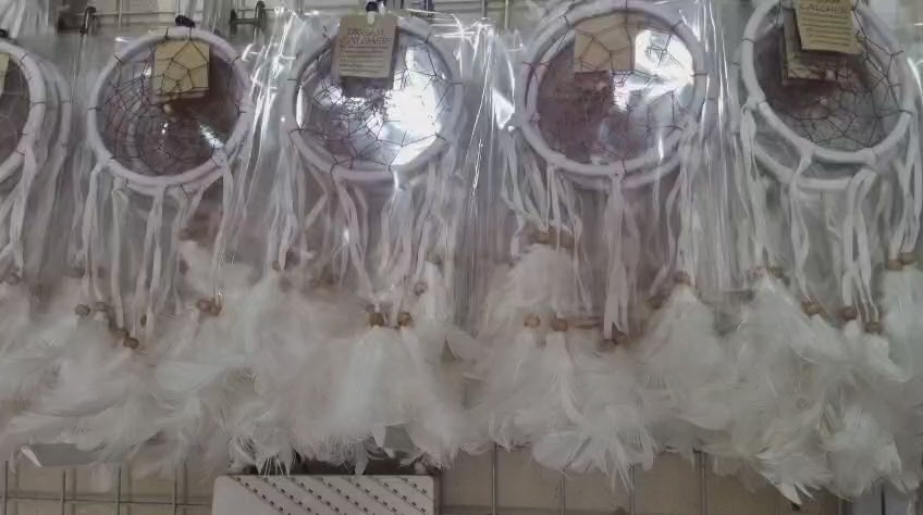 12cm handmade suede dreamcatcher with white feathers and wood beads – perfect for home décor or wholesale gifts.