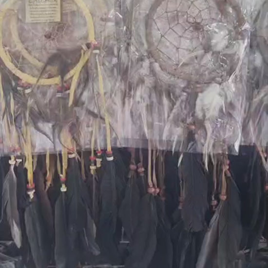 Artisan handmade dreamcatcher with cotton wrap, feathers, and wooden beads, 12cm diameter