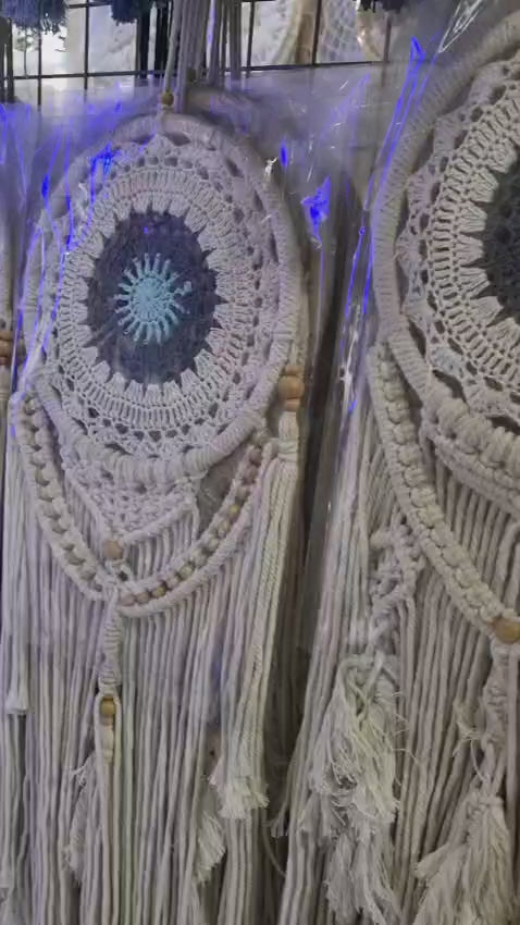 Crochet and macrame cotton dreamcatcher with evil eye motif and hanging tassels, 22cm diameter, handmade spiritual decor

