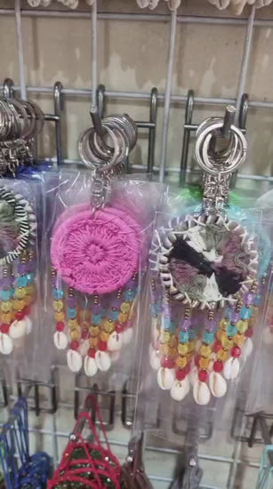 Mini dreamcatcher keychain handmade with cotton crochet, colorful beads, and shells
