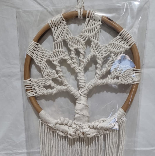 Handmade Tree of Life dreamcatcher made with macrame cotton rope and a rattan ring, featuring minimalist fringe for boho and spiritual interiors.