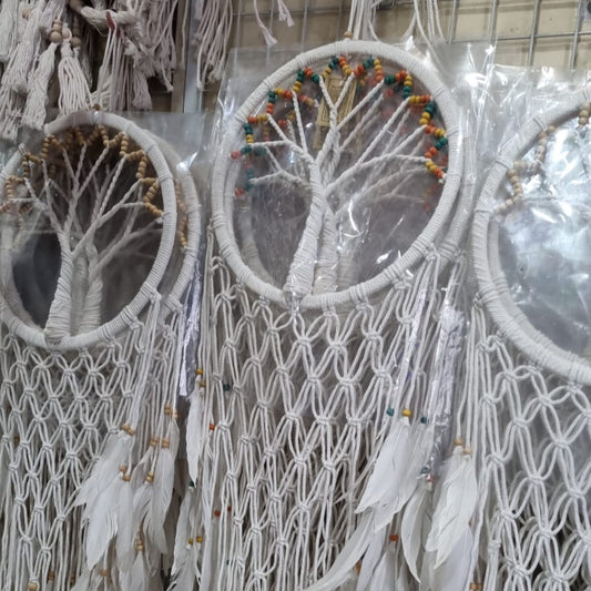 Macrame dreamcatcher in Tree of Life design, featuring wooden beads and white feathers, ideal for boho home decor or spiritual spaces.