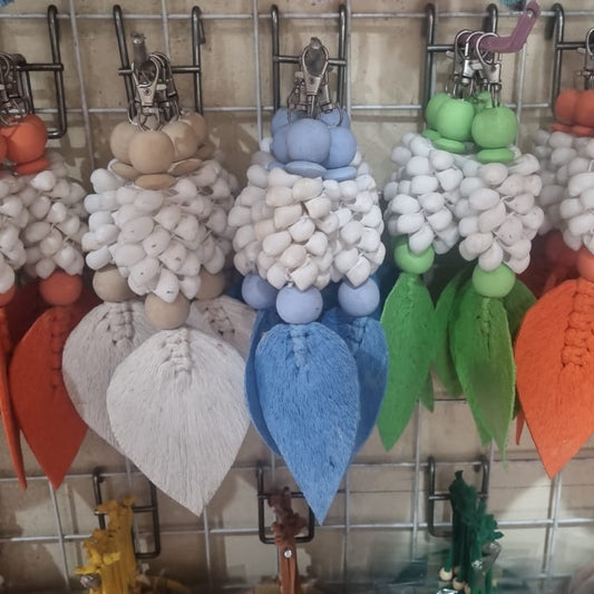Handcrafted wooden shell keychain with colorful cotton tassel, perfect for wholesale and custom orders